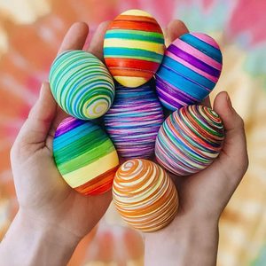 Colorful stripped Easter eggs done by kids with markers